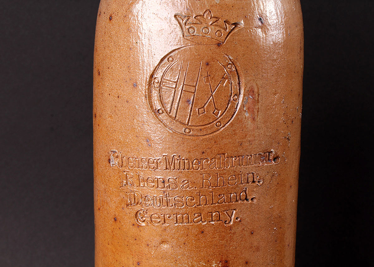 Three Vintage Alcohol Jugs