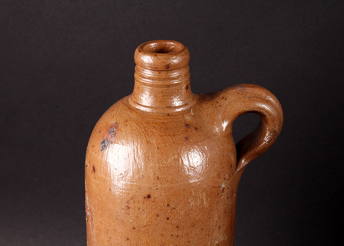 Three Vintage Alcohol Jugs