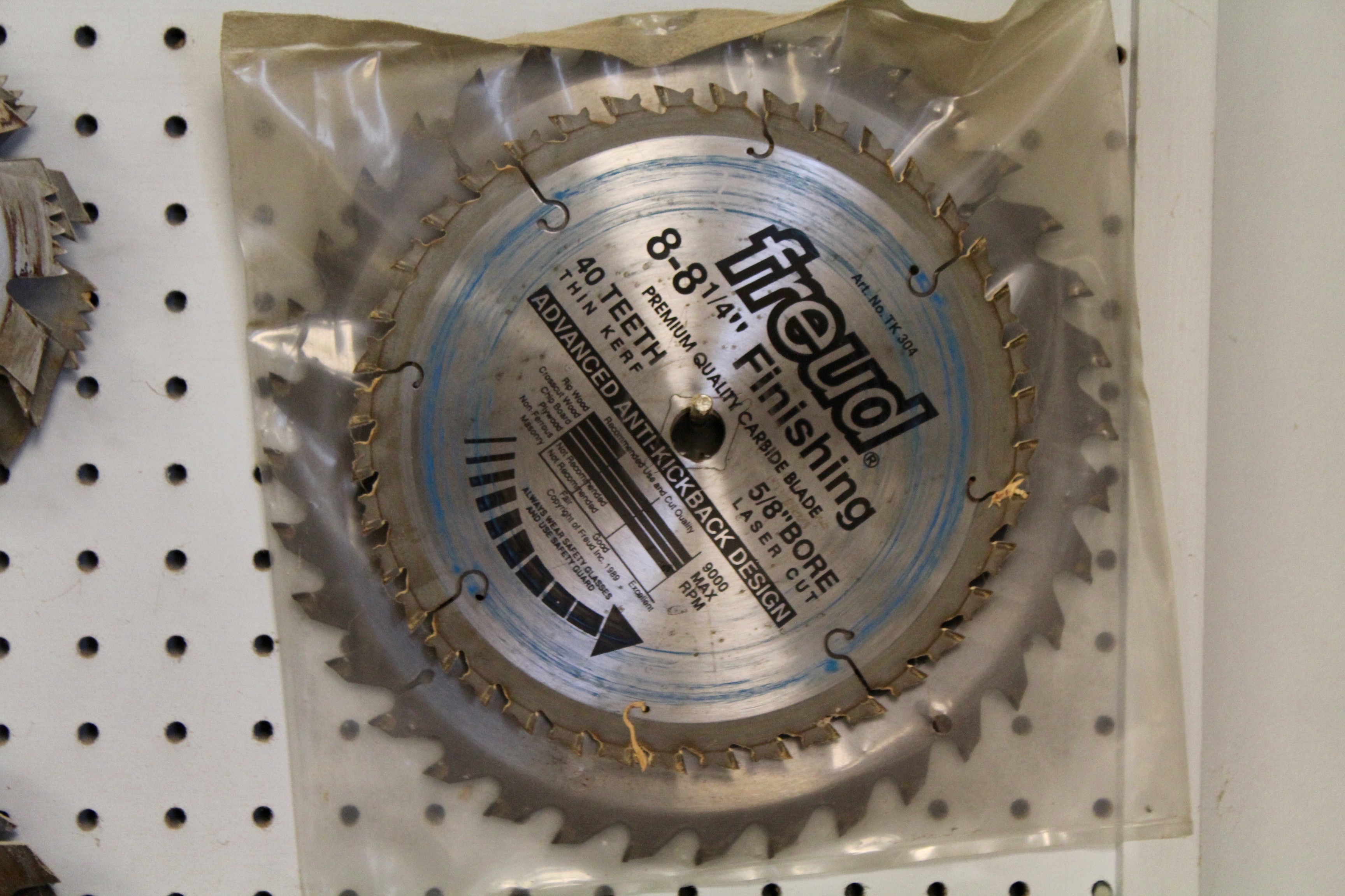 DeWalt Power Shop Radial Arm Saw on Stand and Wall of Blades