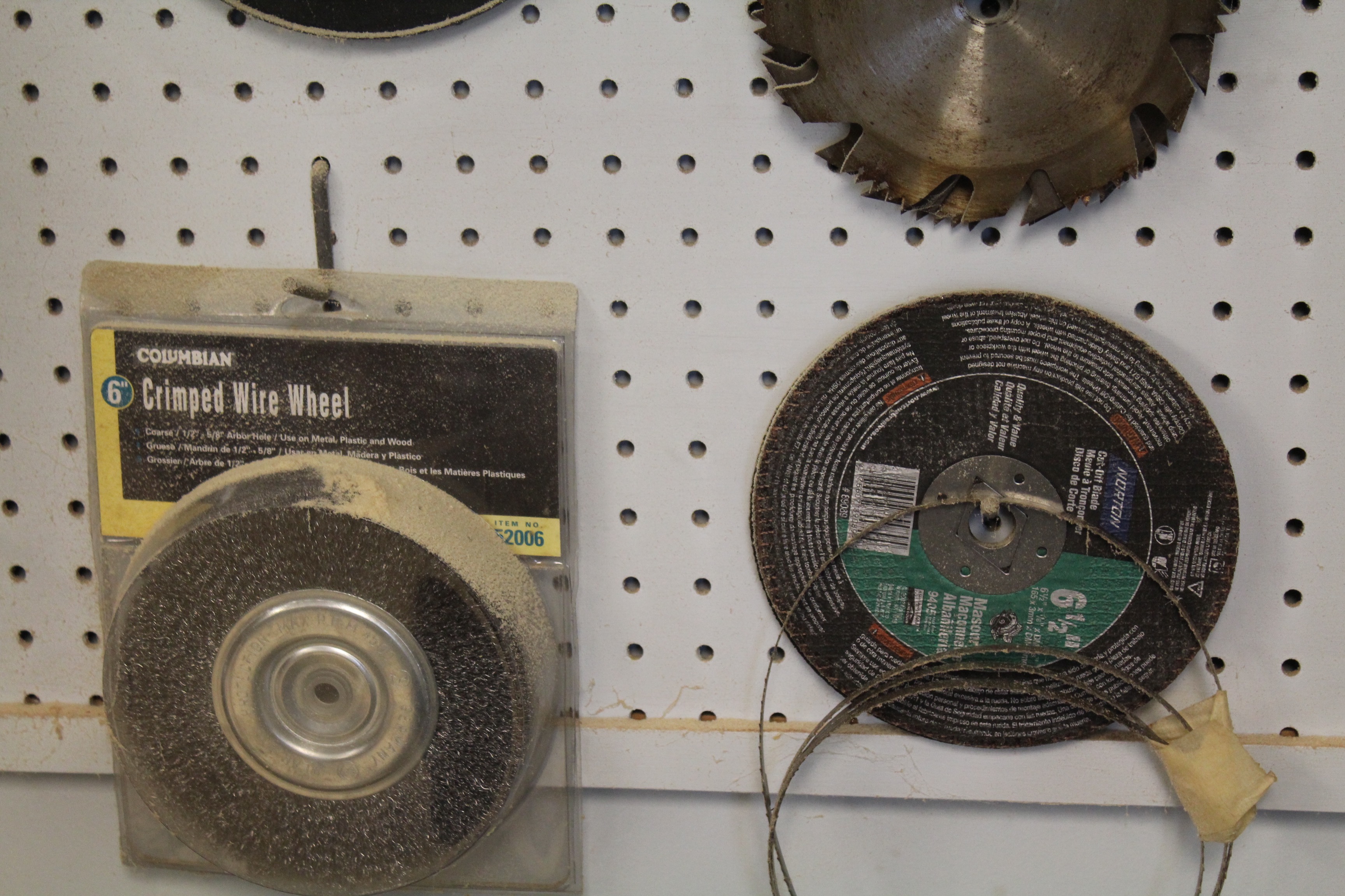 DeWalt Power Shop Radial Arm Saw on Stand and Wall of Blades