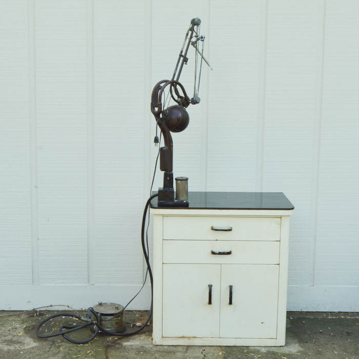 Vintage Metal Cabinet with an Enamel Top and Attached Dentist Drill