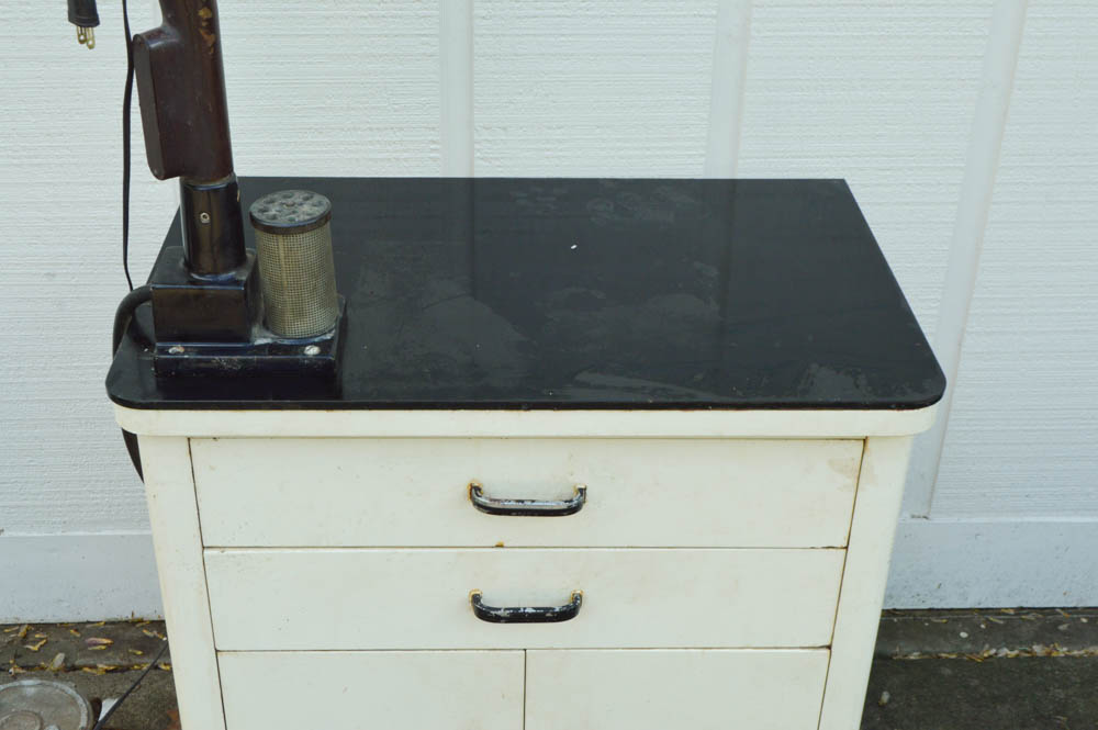 Vintage Metal Cabinet with an Enamel Top and Attached Dentist Drill