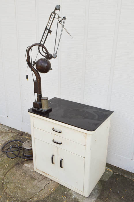 Vintage Metal Cabinet with an Enamel Top and Attached Dentist Drill