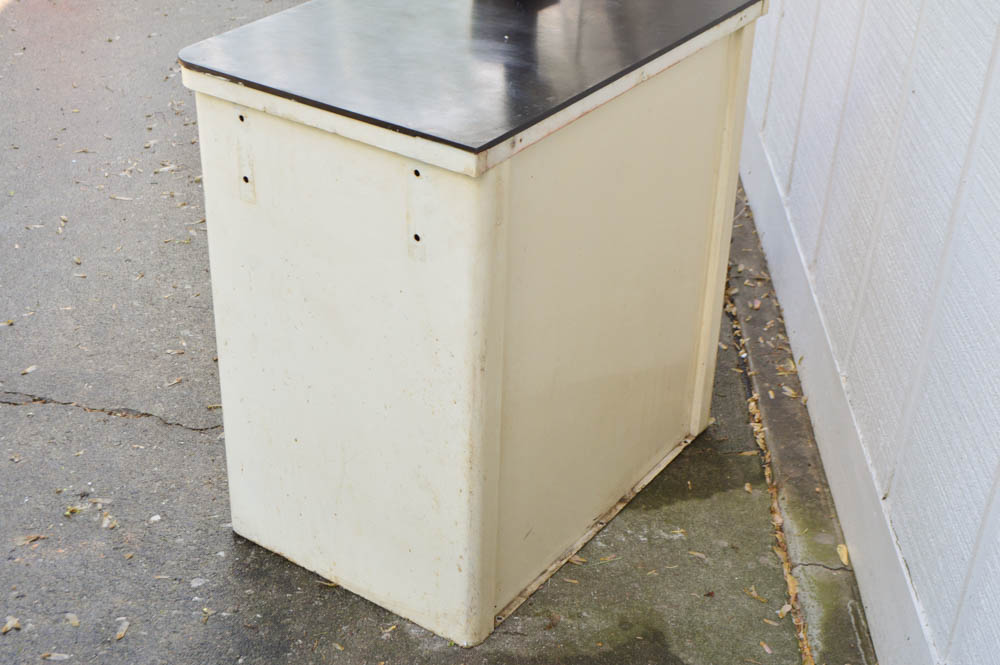 Vintage Metal Cabinet with an Enamel Top and Attached Dentist Drill