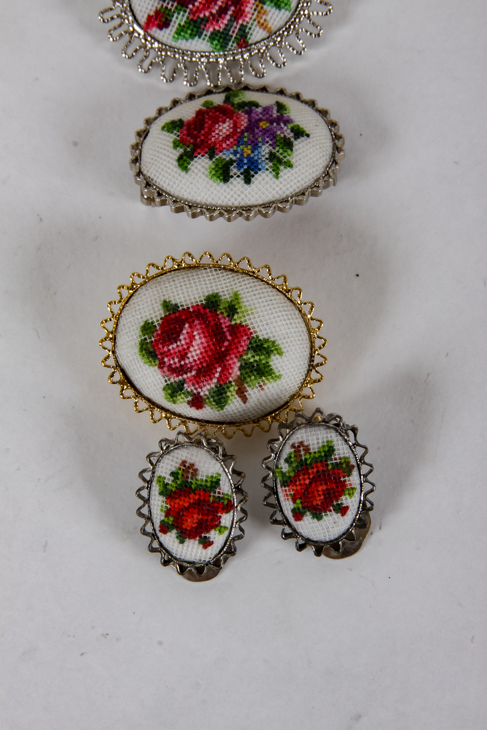 Collection of Hand-Embroidered Floral Brooches and Earrings