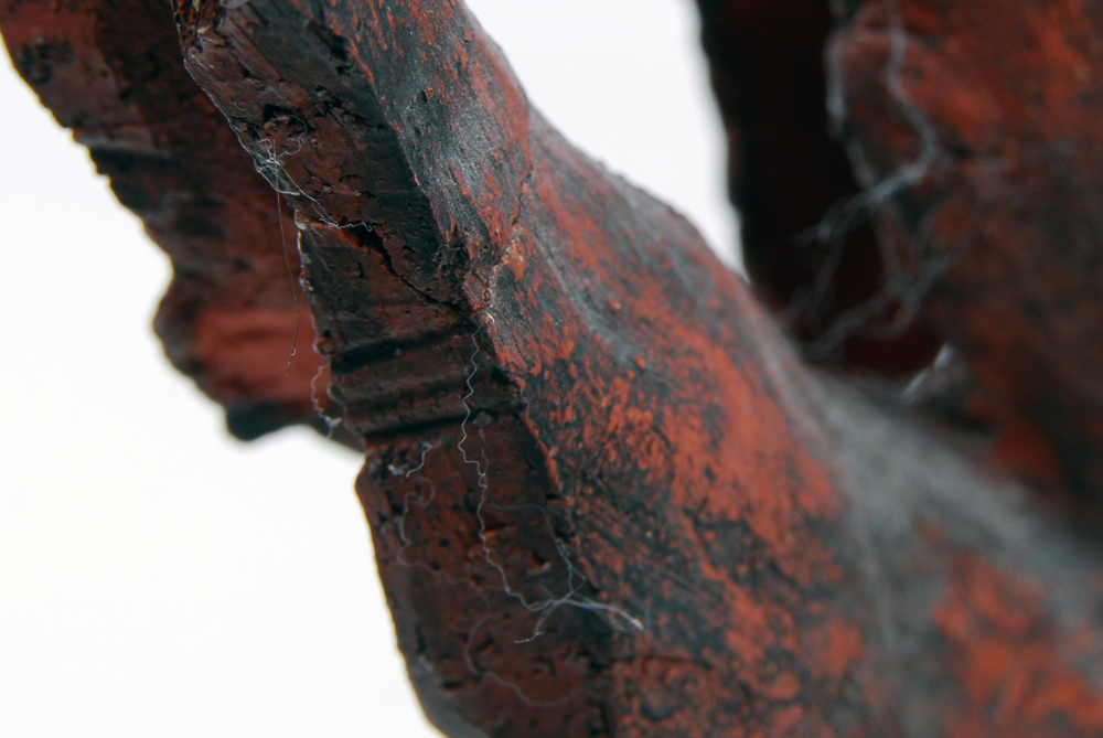 Ceramic Sculpture Depicting Two Bodies in Driftwood