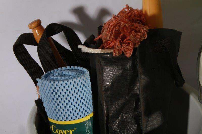 Assortment of Cleaning Supplies and Plastic Buckets