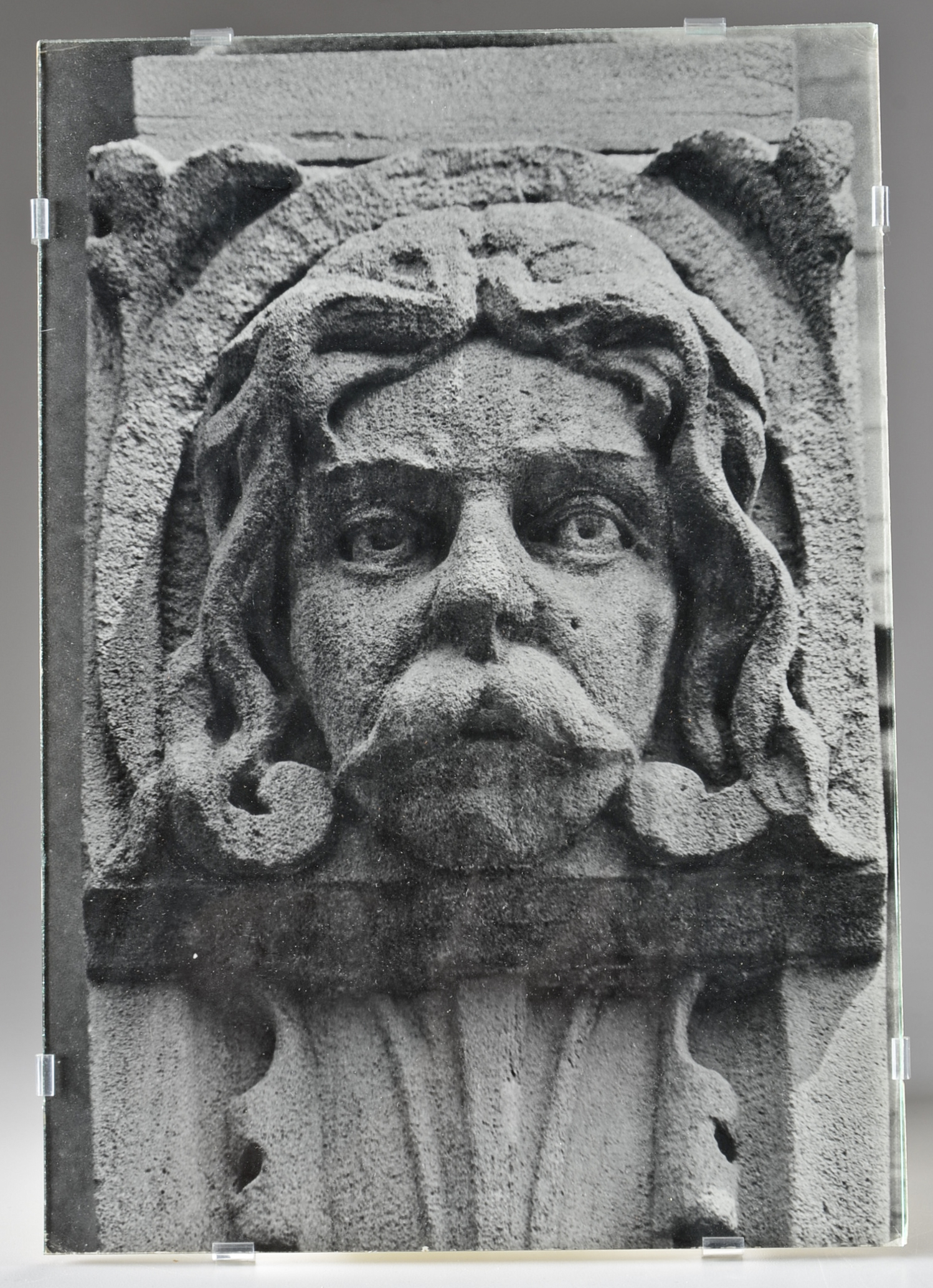 Pair of Photographs of Stone Carvings Under Glass