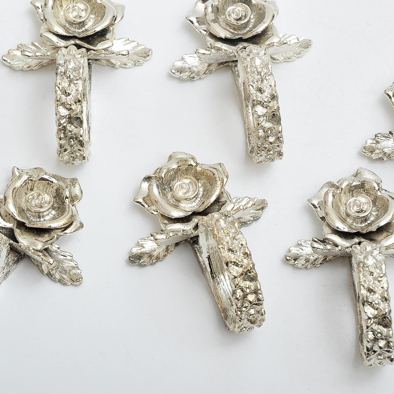Eight Silver-Tone Rose Napkin Rings