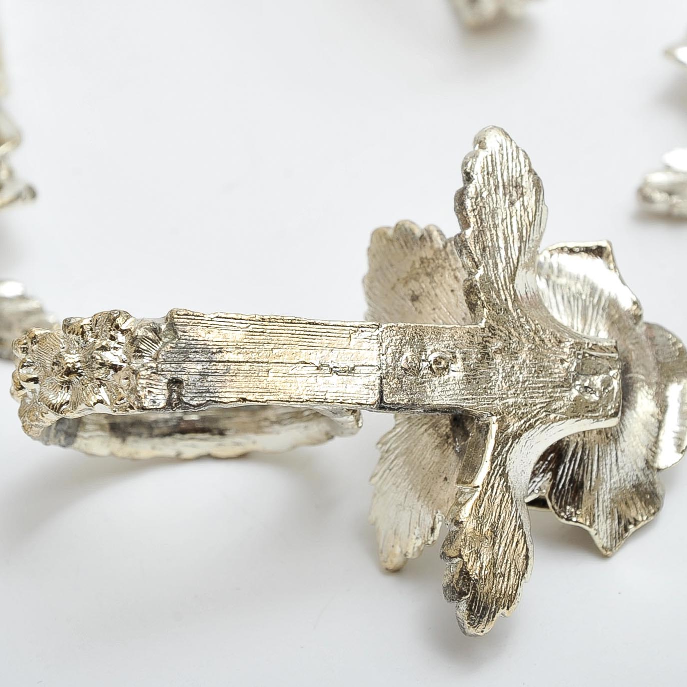 Eight Silver-Tone Rose Napkin Rings