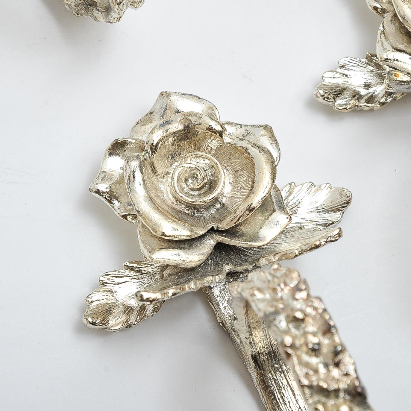 Eight Silver-Tone Rose Napkin Rings