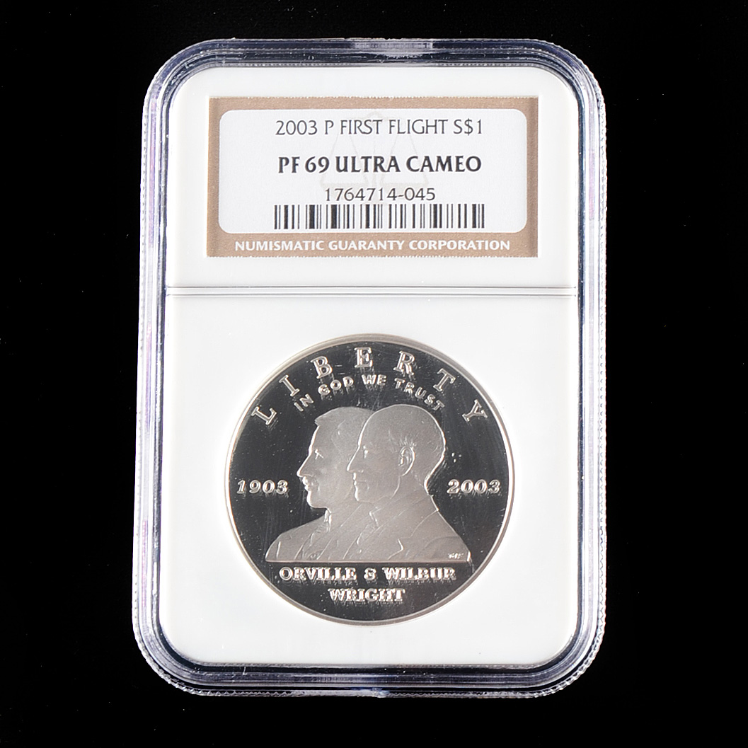 Graded PF69 ULTRA CAMEO (By NGC) 2003 P First Flight Commemorative Silver Dollar Proof Coin