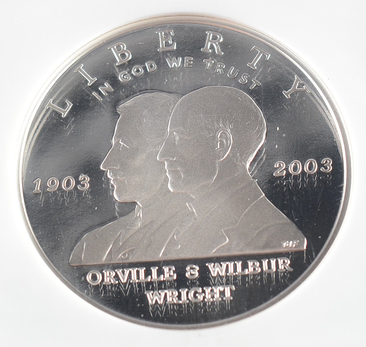 Graded PF69 ULTRA CAMEO (By NGC) 2003 P First Flight Commemorative Silver Dollar Proof Coin