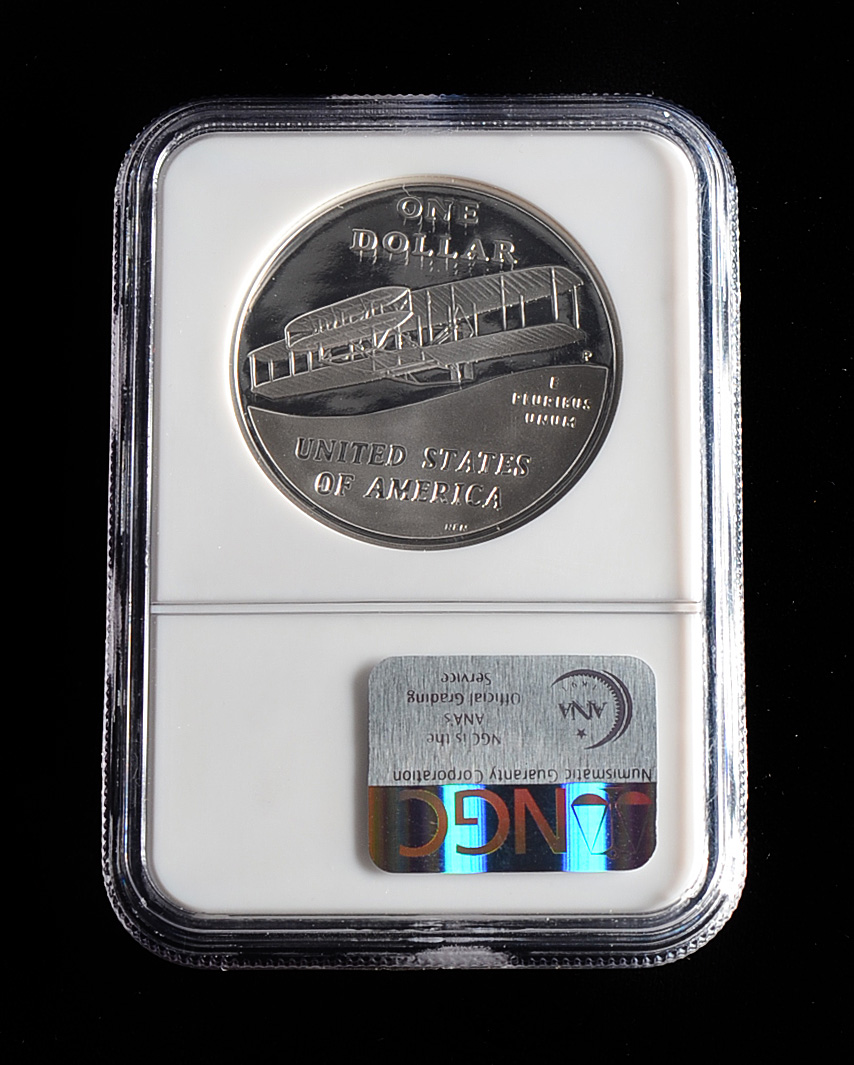 Graded PF69 ULTRA CAMEO (By NGC) 2003 P First Flight Commemorative Silver Dollar Proof Coin