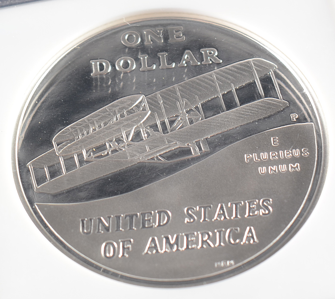 Graded PF69 ULTRA CAMEO (By NGC) 2003 P First Flight Commemorative Silver Dollar Proof Coin