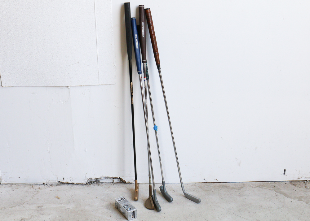 Group of Golf Clubs and Accessories
