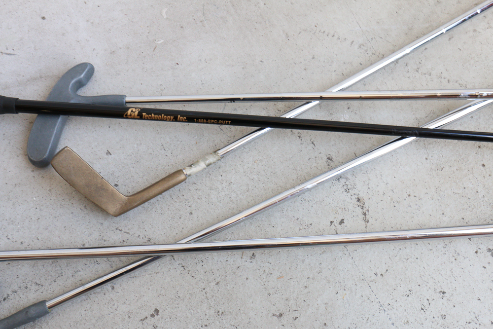 Group of Golf Clubs and Accessories