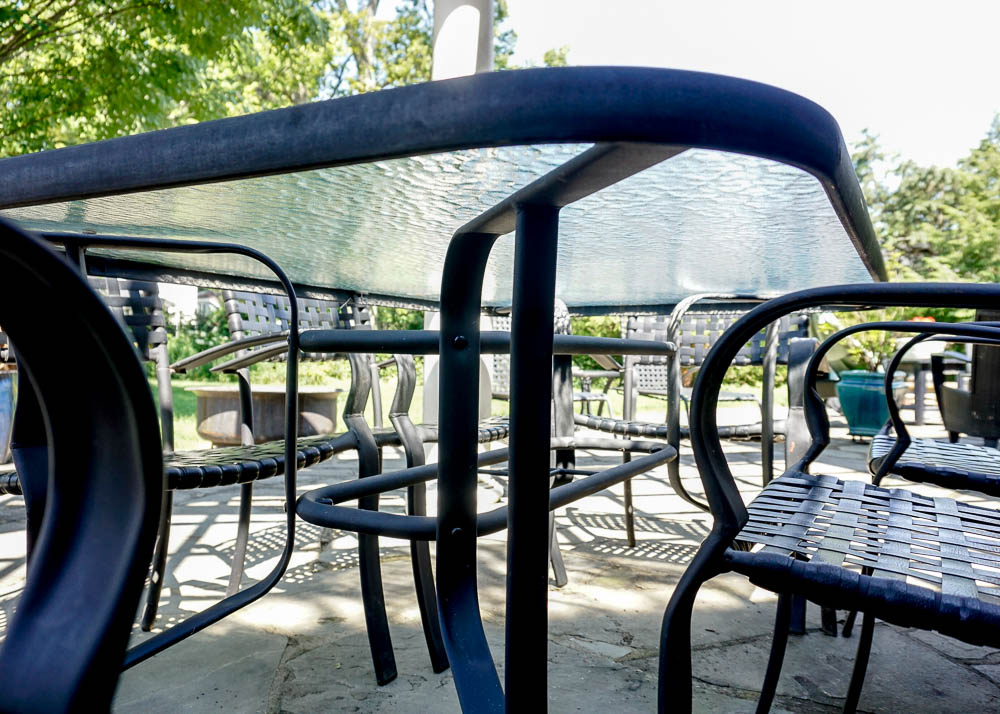 Glass Top Metal Patio Table and Six Metal Patio Chairs