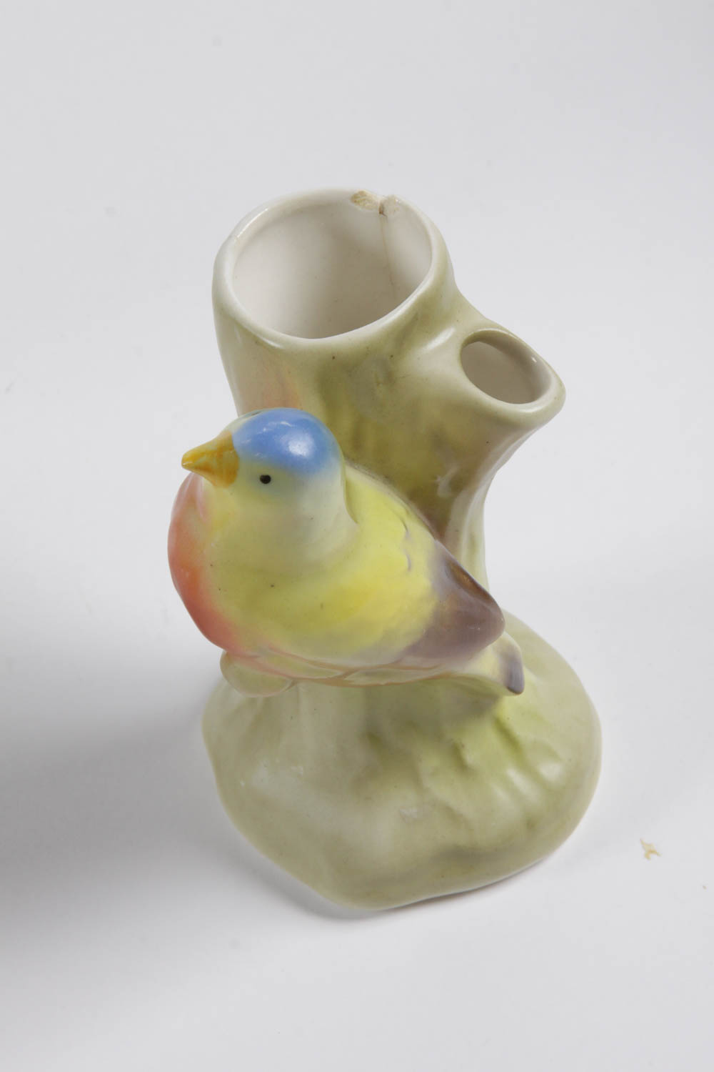 Set of Colorful Plates and Ceramic Birds