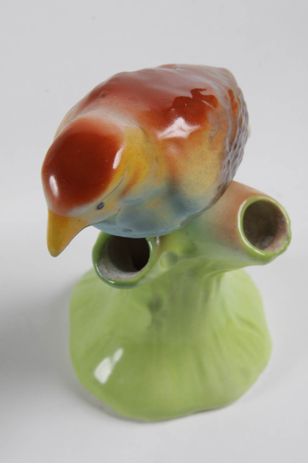 Set of Colorful Plates and Ceramic Birds