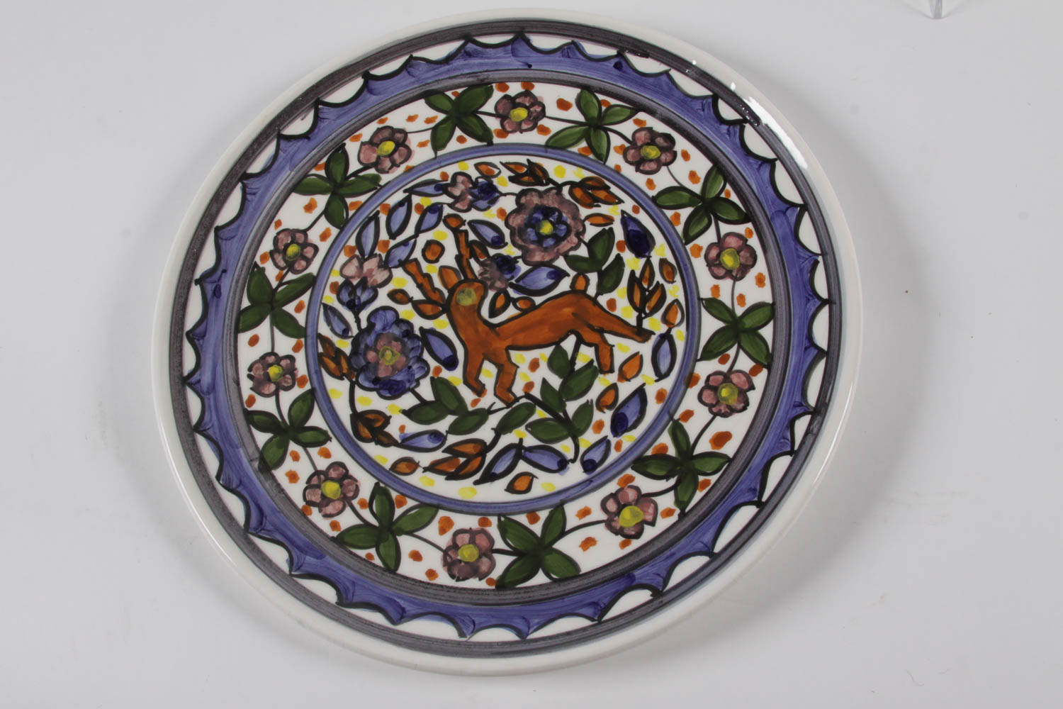 Set of Colorful Plates and Ceramic Birds