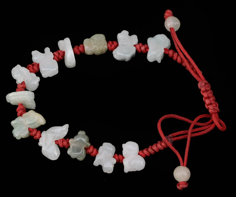 Four Jadeite Carving and Beaded Handmade Bracelets and a Tourmalinated Quartz Necklace with Plastic Beads