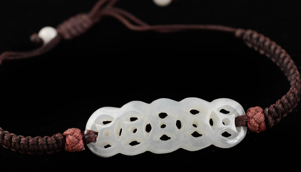 Four Jadeite Carving and Beaded Handmade Bracelets and a Tourmalinated Quartz Necklace with Plastic Beads