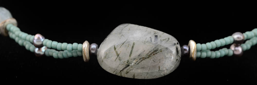 Four Jadeite Carving and Beaded Handmade Bracelets and a Tourmalinated Quartz Necklace with Plastic Beads