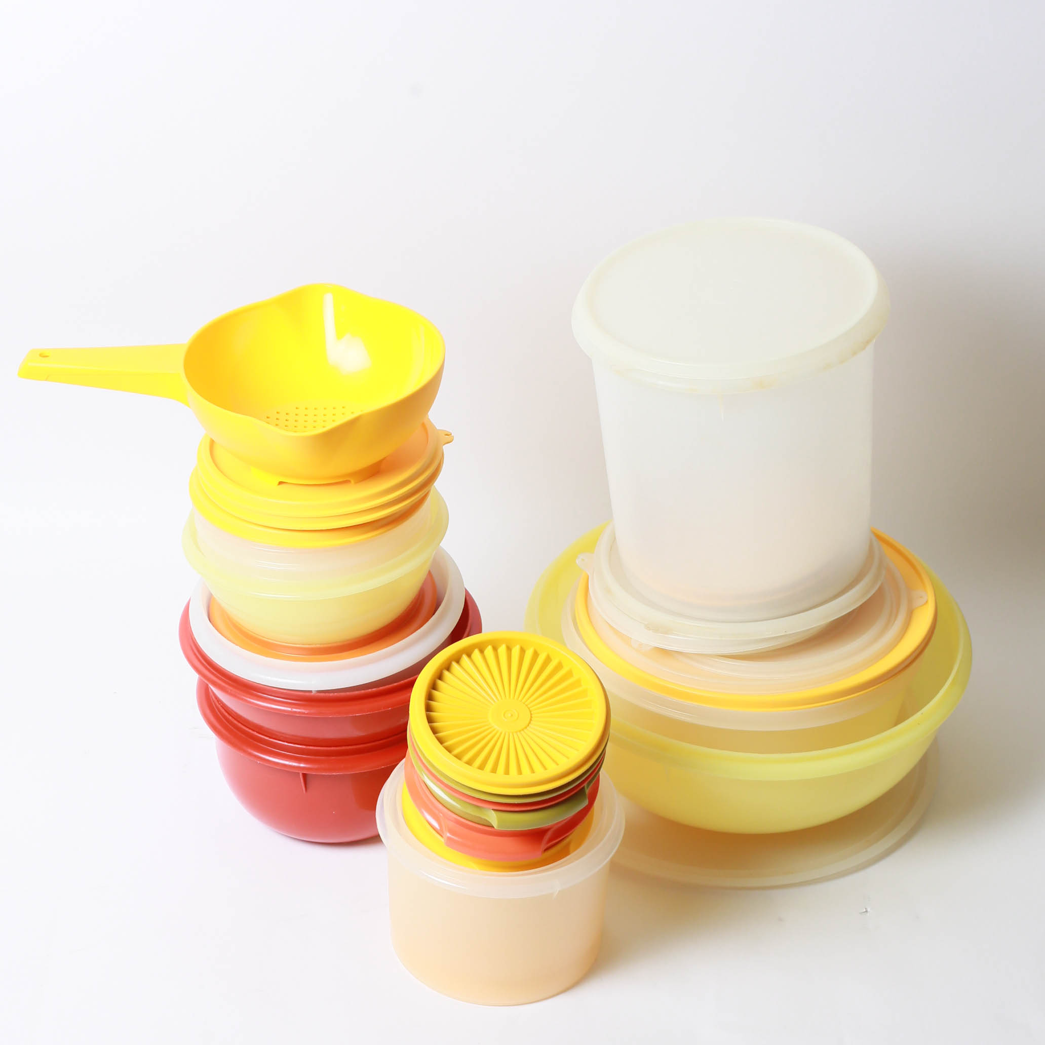 Collection of Food Storage Containers and Measuring Utensiles