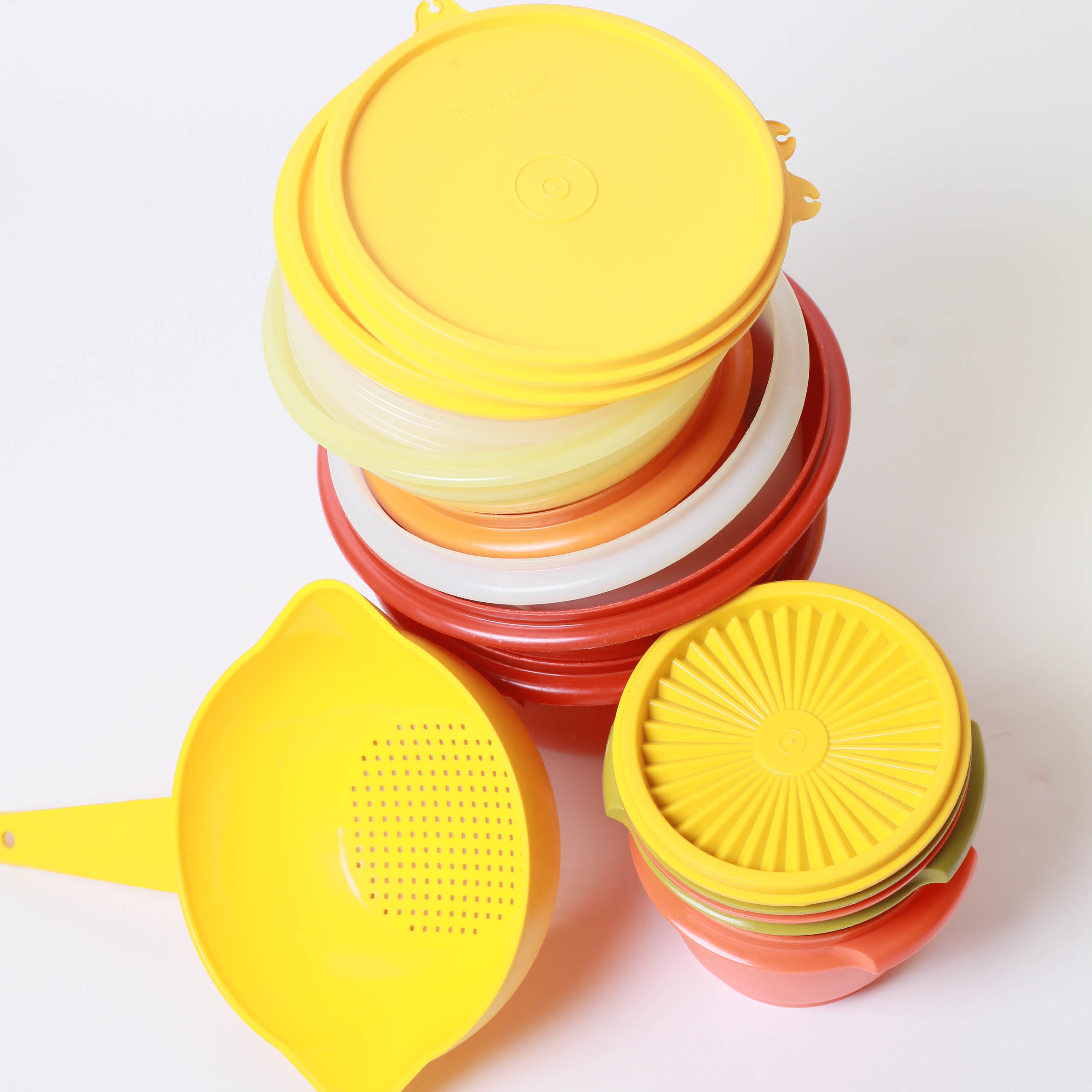 Collection of Food Storage Containers and Measuring Utensiles