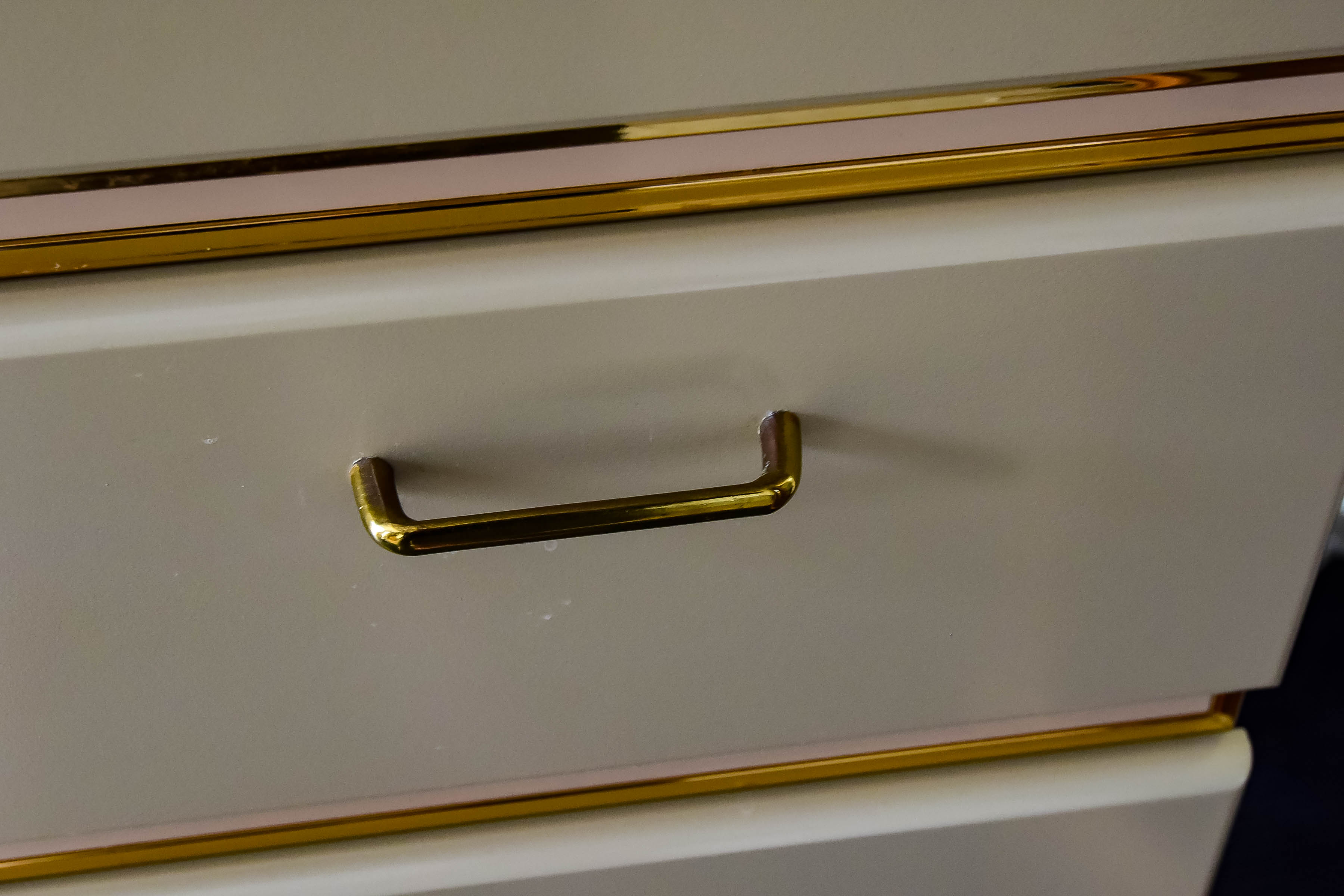 White Wooden Dresser with Gold Tone Trim