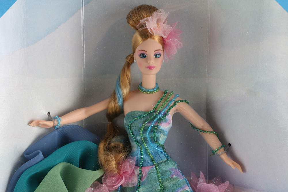 Claude Monet "Water Lily" Barbie and Porcelain Holiday Caroler Barbie Doll Pairing