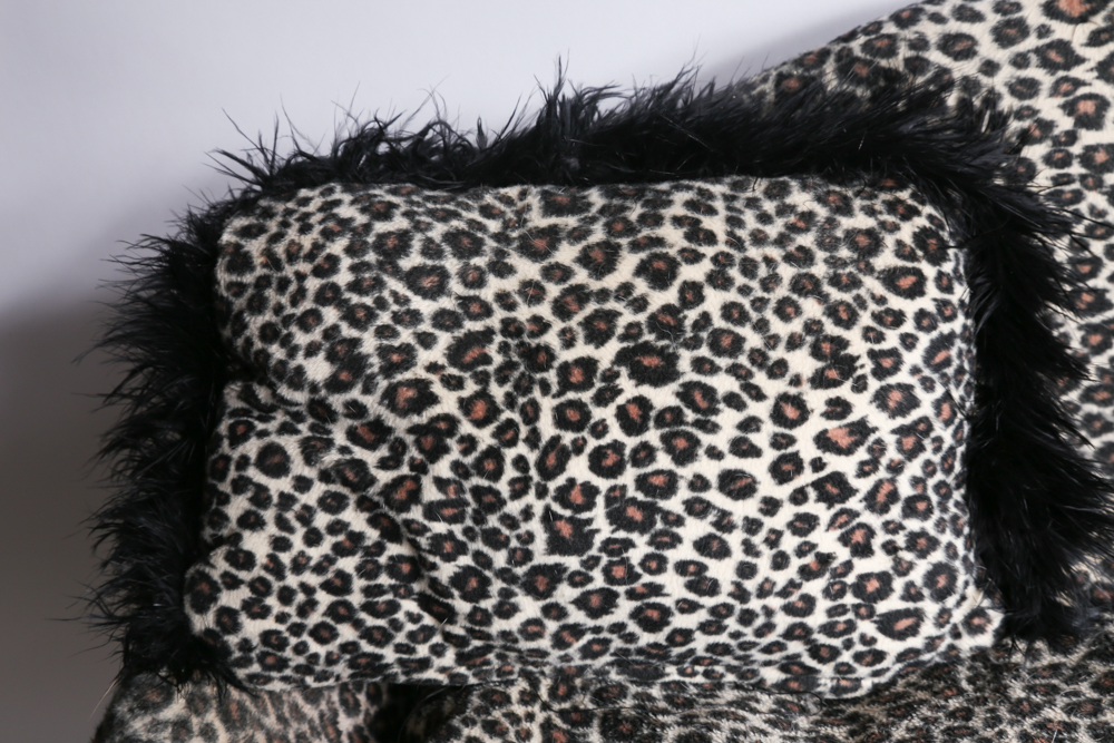 Mini Couch with Leopard Print Upholstery and Two Pillows