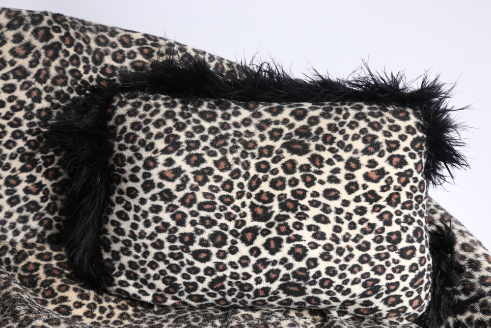 Mini Couch with Leopard Print Upholstery and Two Pillows