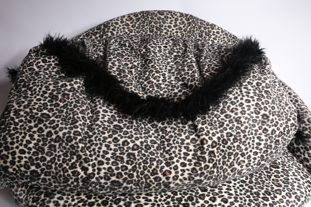 Mini Couch with Leopard Print Upholstery and Two Pillows