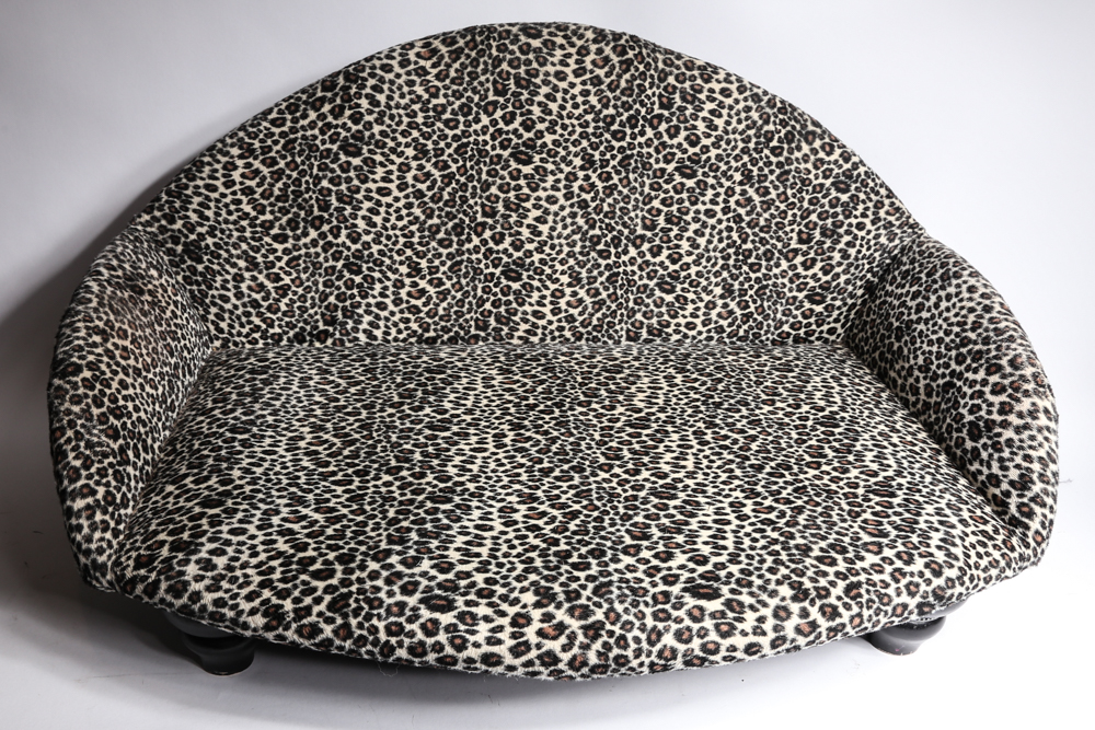 Mini Couch with Leopard Print Upholstery and Two Pillows