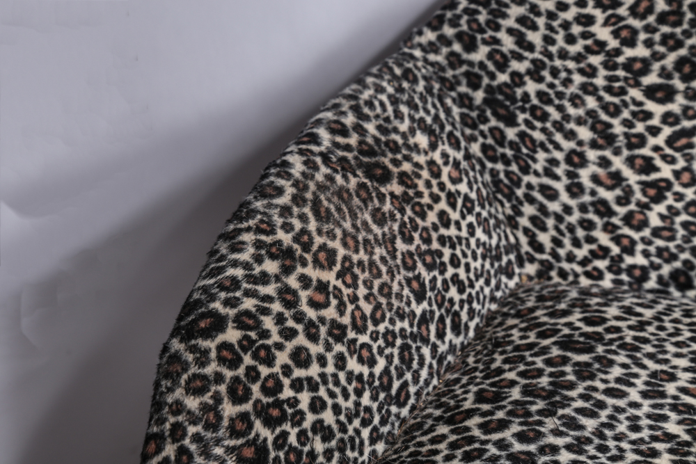 Mini Couch with Leopard Print Upholstery and Two Pillows