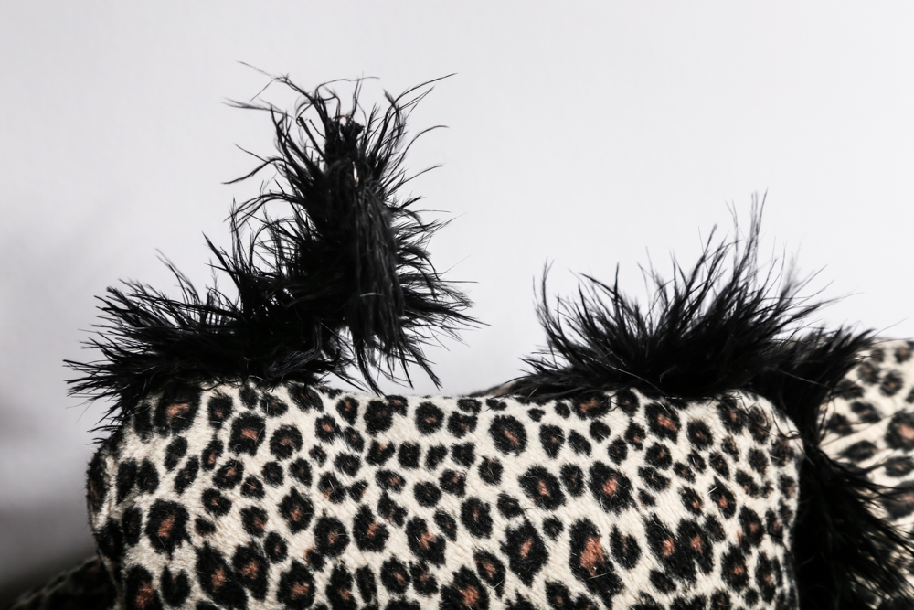 Mini Couch with Leopard Print Upholstery and Two Pillows