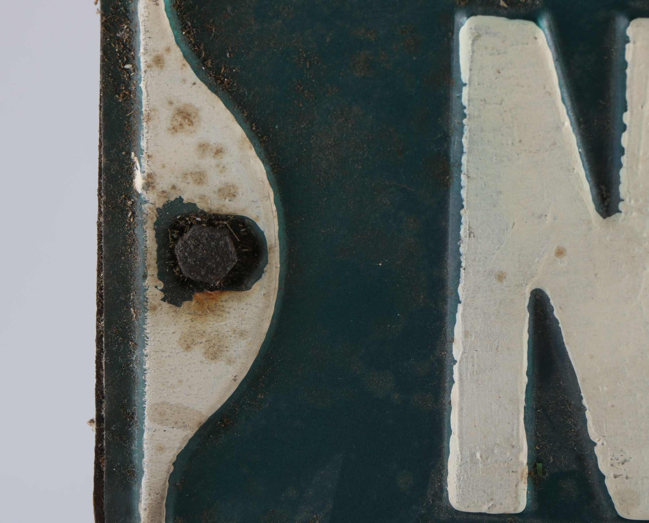 A Vintage Green and White Street Sign