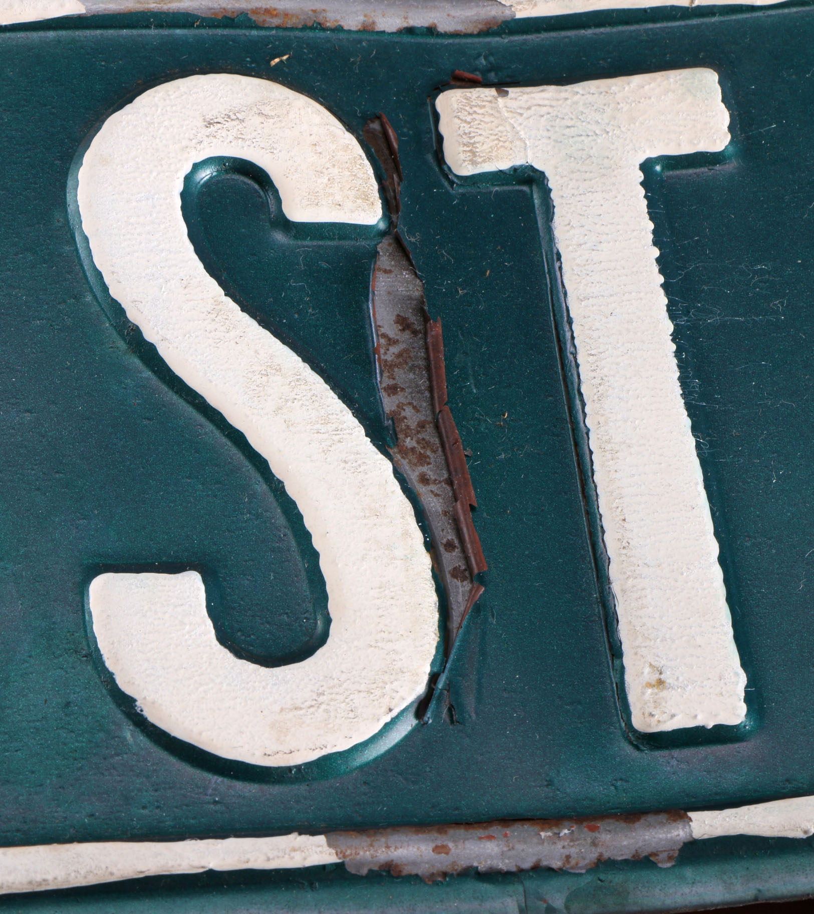 A Vintage Green and White Street Sign