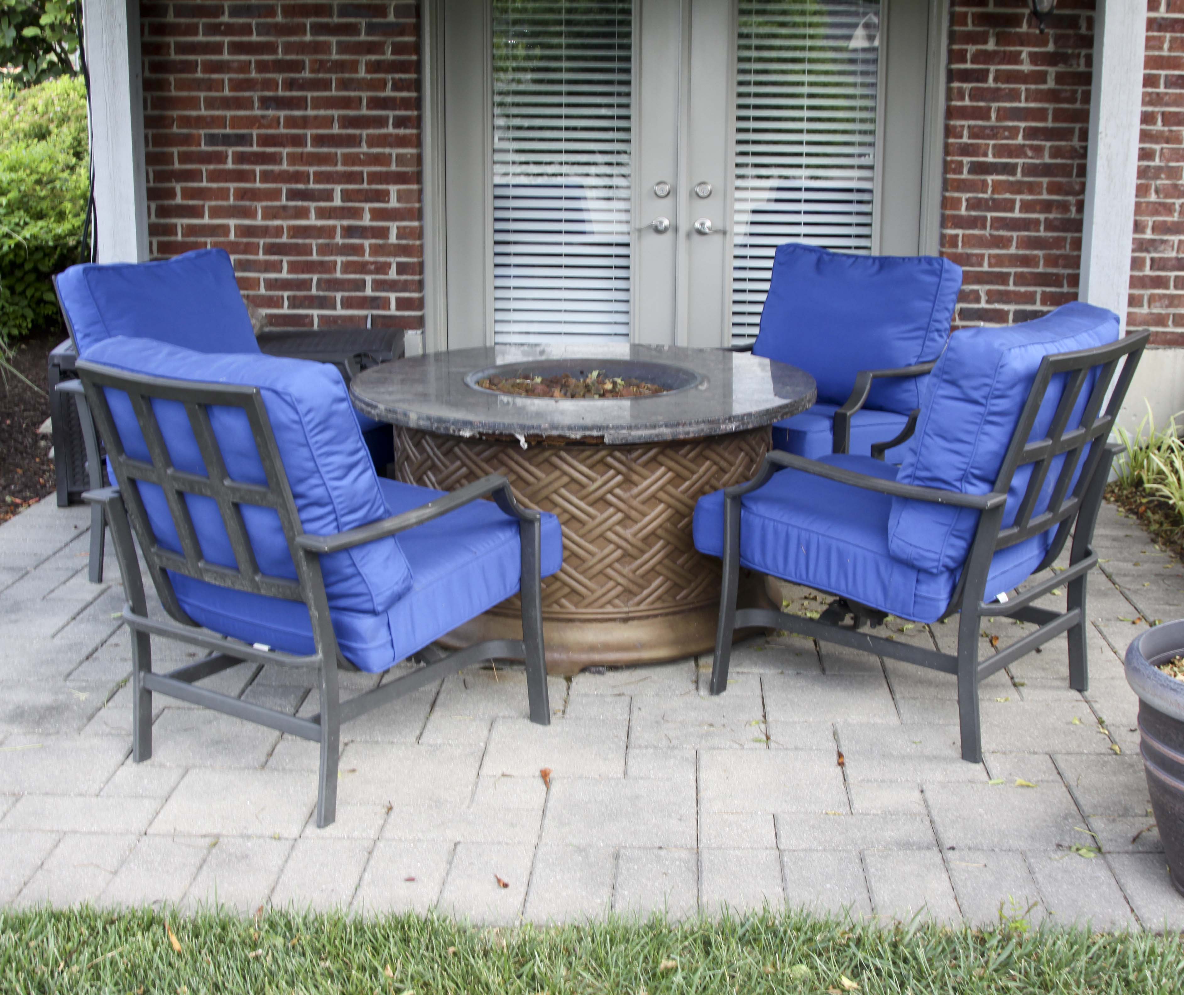 Four Frontgate Patio Chairs with Royal Blue Cushions