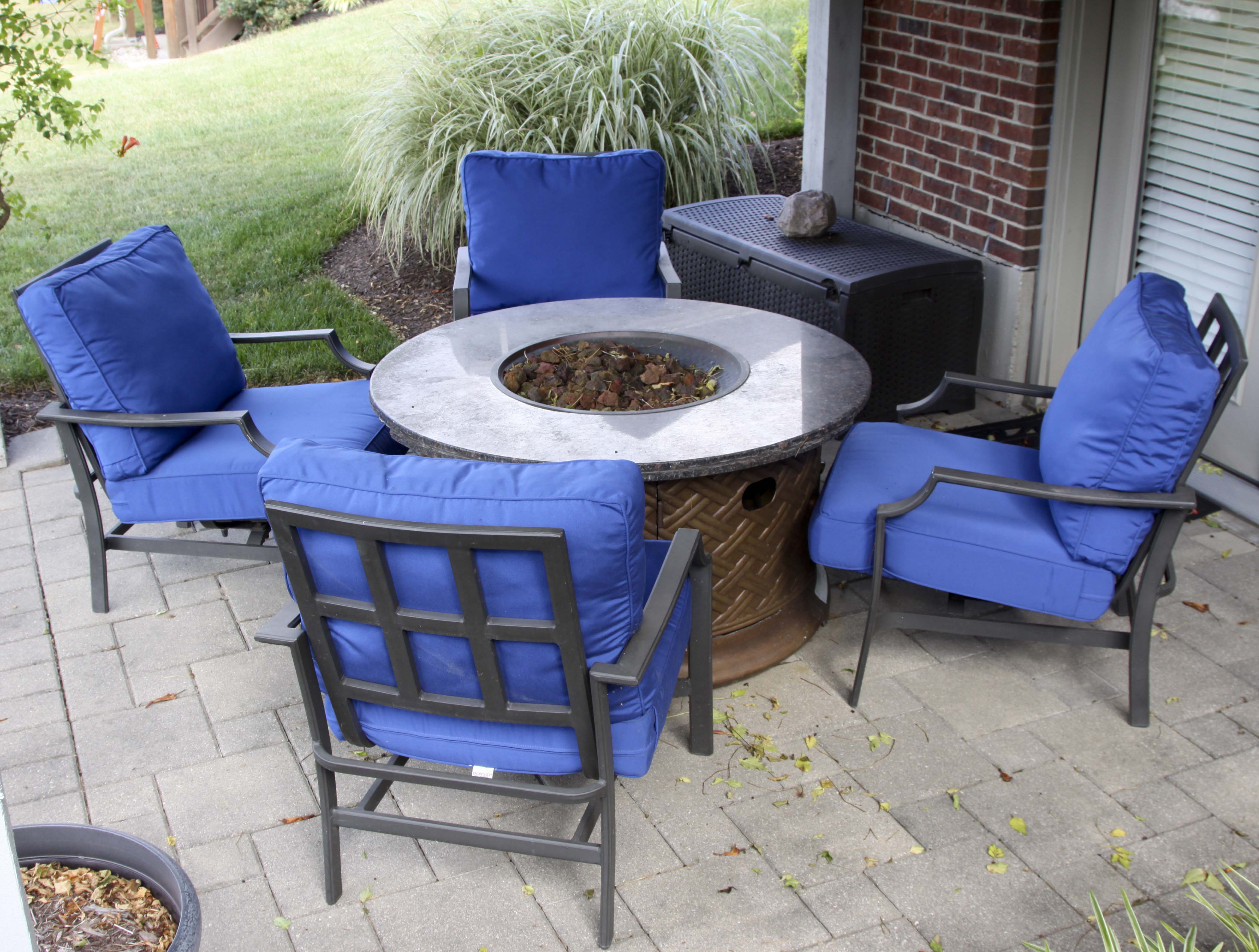 Four Frontgate Patio Chairs with Royal Blue Cushions