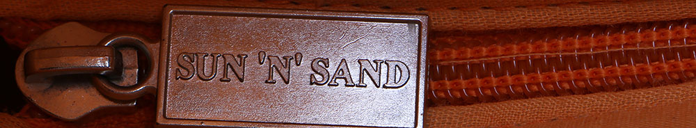 Six Straw Purses and One Straw Hat