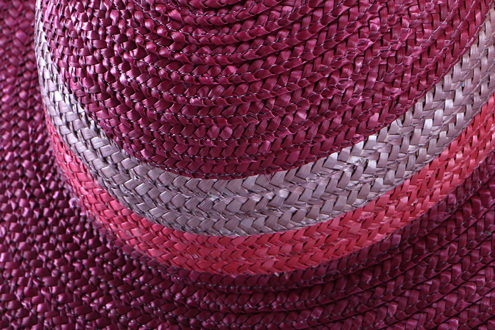 Six Straw Purses and One Straw Hat