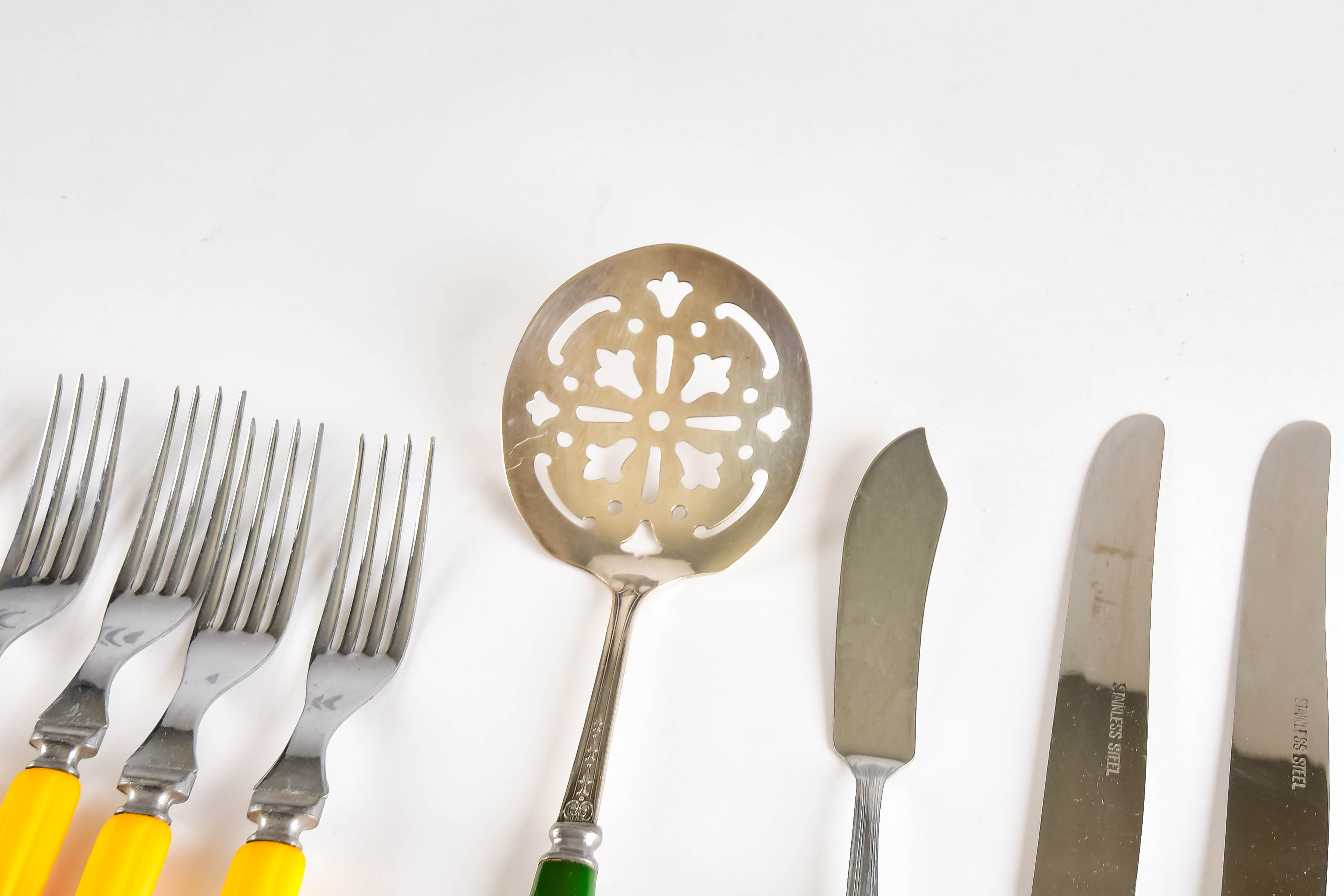 Collection of Vintage Stainless and Bakelite Flatware