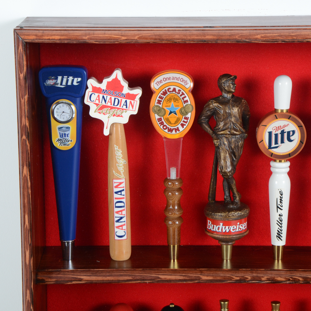 Collection of Bar Tap Handles in Display Case