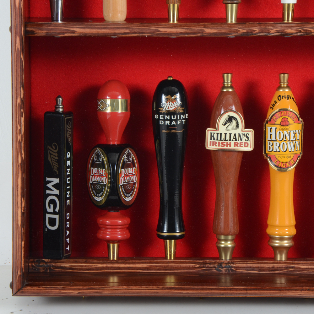 Collection of Bar Tap Handles in Display Case
