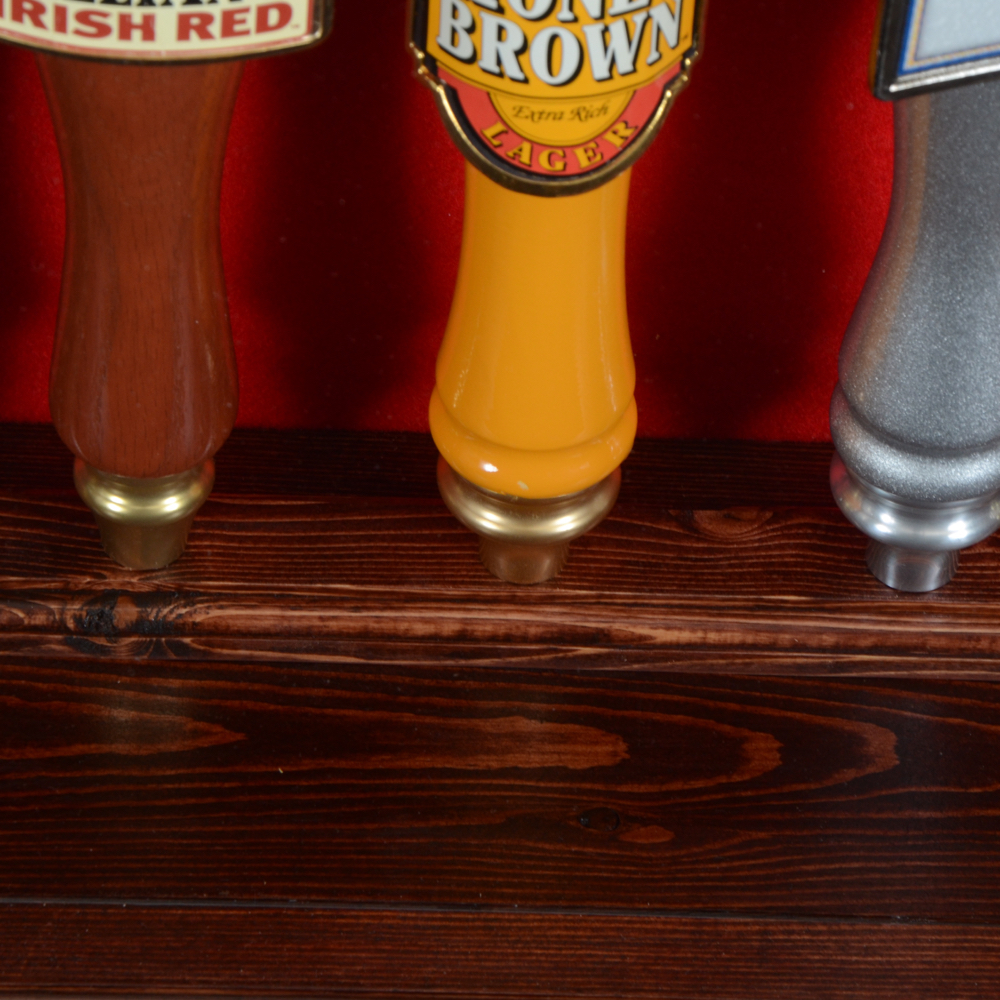 Collection of Bar Tap Handles in Display Case