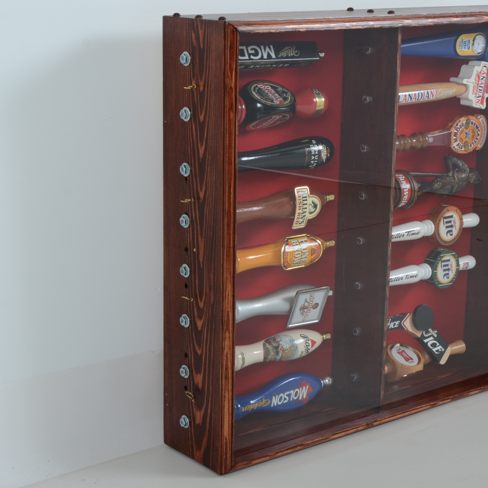 Collection of Bar Tap Handles in Display Case