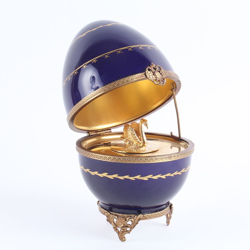 Fabergé Limoges and Sterling Silver Swan Egg Music Box